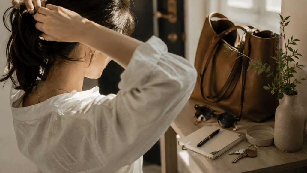 Woman preparing to leave home with everyday essentials
